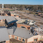 Aerial view of damage to homes, property, and the high school in Wynne, Arkansas following a devastating tornado on March 31, 2023 