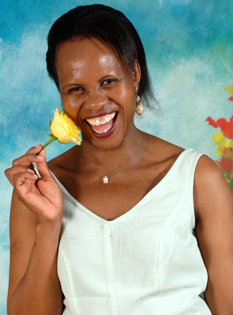 DSC_0140v Ditshupo aka Dee Beautiful Nurse from Botswana in Pale Green Evening Dress with Yellow Rose Flower Friendship message of cheer joy caring and affection Portrait Photoshoot Shoreditch Studio London