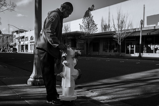 man cleaning hydrant