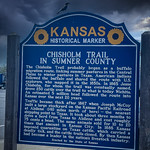 Looks like I'm in Kansas now. I had been in Kansas all of five minutes when I pulled over into a highway rest stop and Kansas information center. Before I could even go inside, a crow landed on this Kansas Chisholm Trail historical marker. He informed me he was on his way to pick the eyes out of a scarecrow who had no common sense.

Then, without warning, there was this incredible funnel cloud. I could see all sorts of things twirling inside of it… cars, boats, farmhouses, cows… etc.

My Alamo Basement Aggie Ring told me, “The only way you might be getting out of this alive is if you were wearing ruby red slippers and tapped them together and said, ‘There’s not place like Texas. There’s no place like Texas.”

I told Aggie Ring. “Well, that does me no good. I wasn’t in the Air Force so I don’t have any ruby red slippers to tap. Do you have any other ideas, wiseass?”

As we were walking back to the car, Aggie Ring began to sing:

I could while away the hours
Conferrin&#039; with the flowers,
Consulting with the rain;
And my head I&#039;d be a scratchin&#039;
While my thoughts are busy hatchin&#039;
If I only had a brain.

I&#039;d unravel every riddle
for any individdle
In trouble or in pain
With the thoughts I’d be thinkin&#039;
I could be another Lincoln
If I only had a brain.

Oh, I, could tell you why 
The oceans near the shore
I could think of things I&#039;d never
Thunk before,