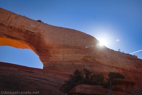 The sun behind Wilson Arch near Moab, Utah
