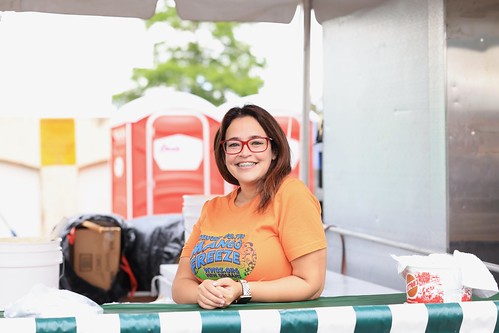 Working at the Mango Freeze booth on the first day of French Quarter Fest - April 13, 2023. Photo by Michele Goldfarb.