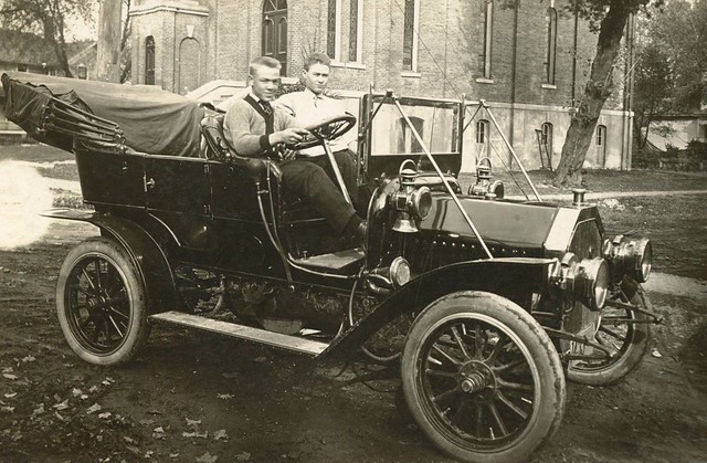 Two Young Men In a Brass Era Auto