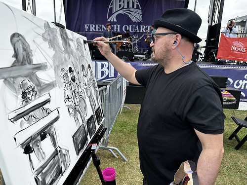 Frenchy paints at French Quarter Fest - April 13, 2023. Photo by Marc PoKempner.