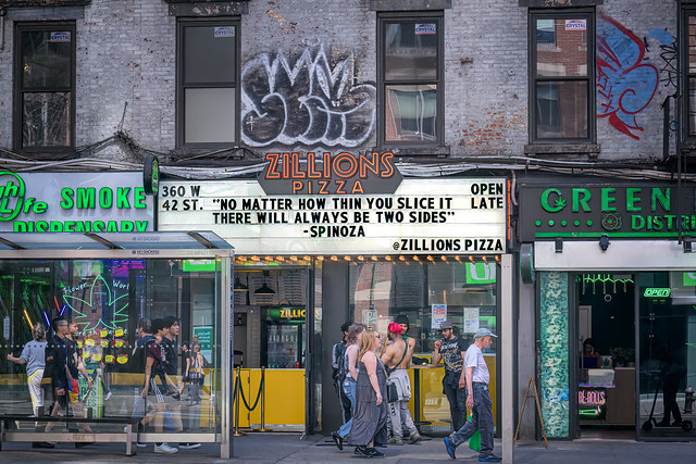 Pizza philosophy on marquee on 42nd Street near Ninth Avenue, Manhattan, New York City