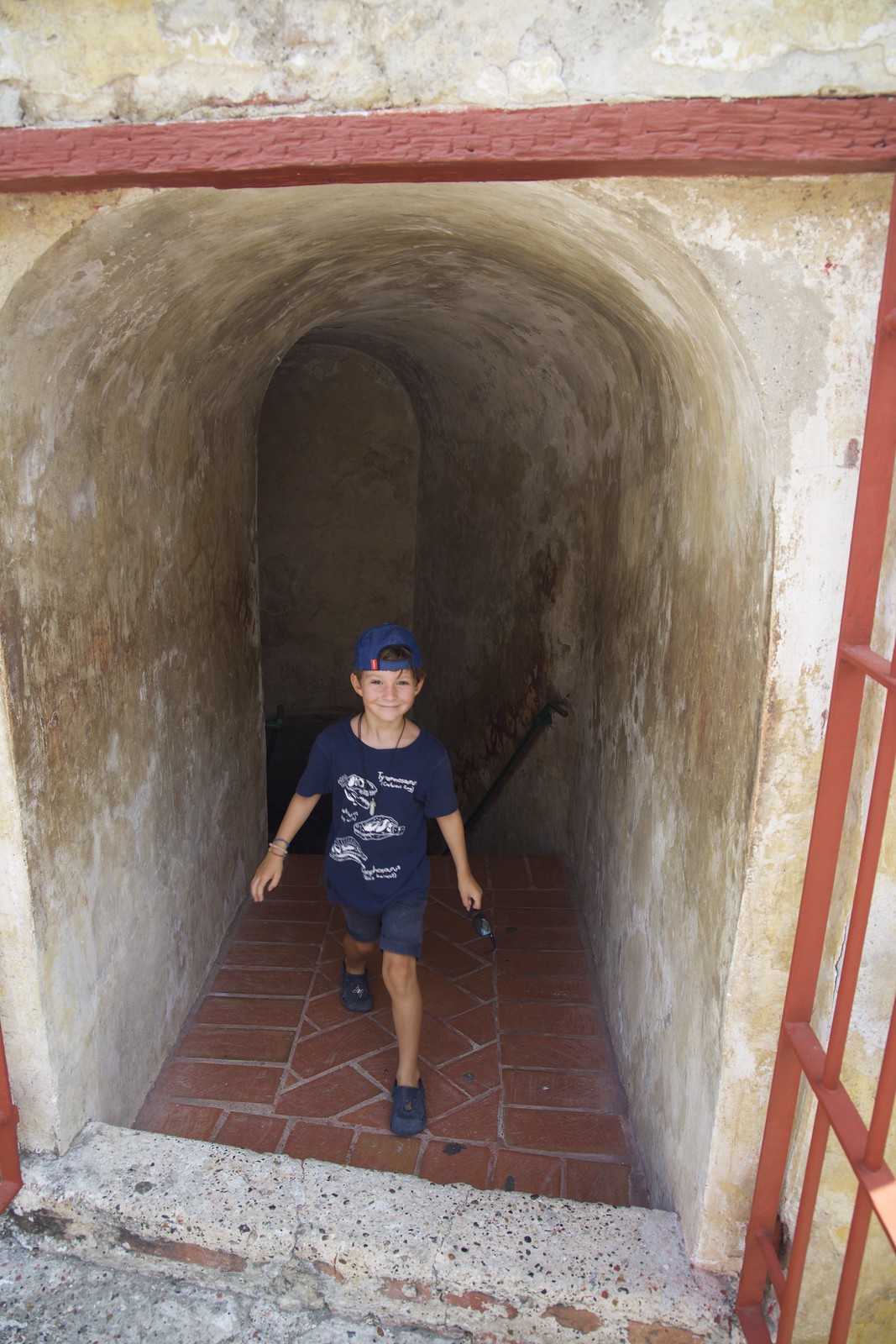 Boy stepping out of one of the tunnels in the fortress