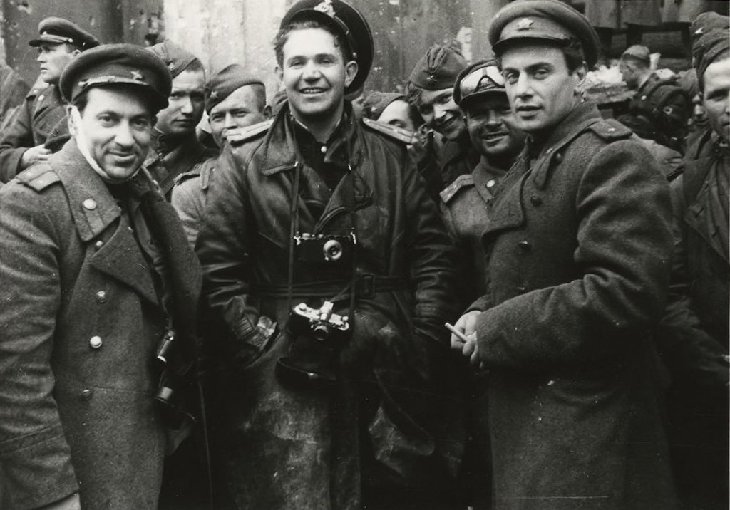 Photo correspondents Viktor Temin, Yevgeny Khaldei, and poet Yevgeny Dolmatovsky at the Reichstag walls. May 2, 1945