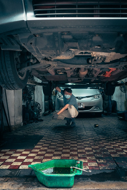 Mechanic under car @HongKong