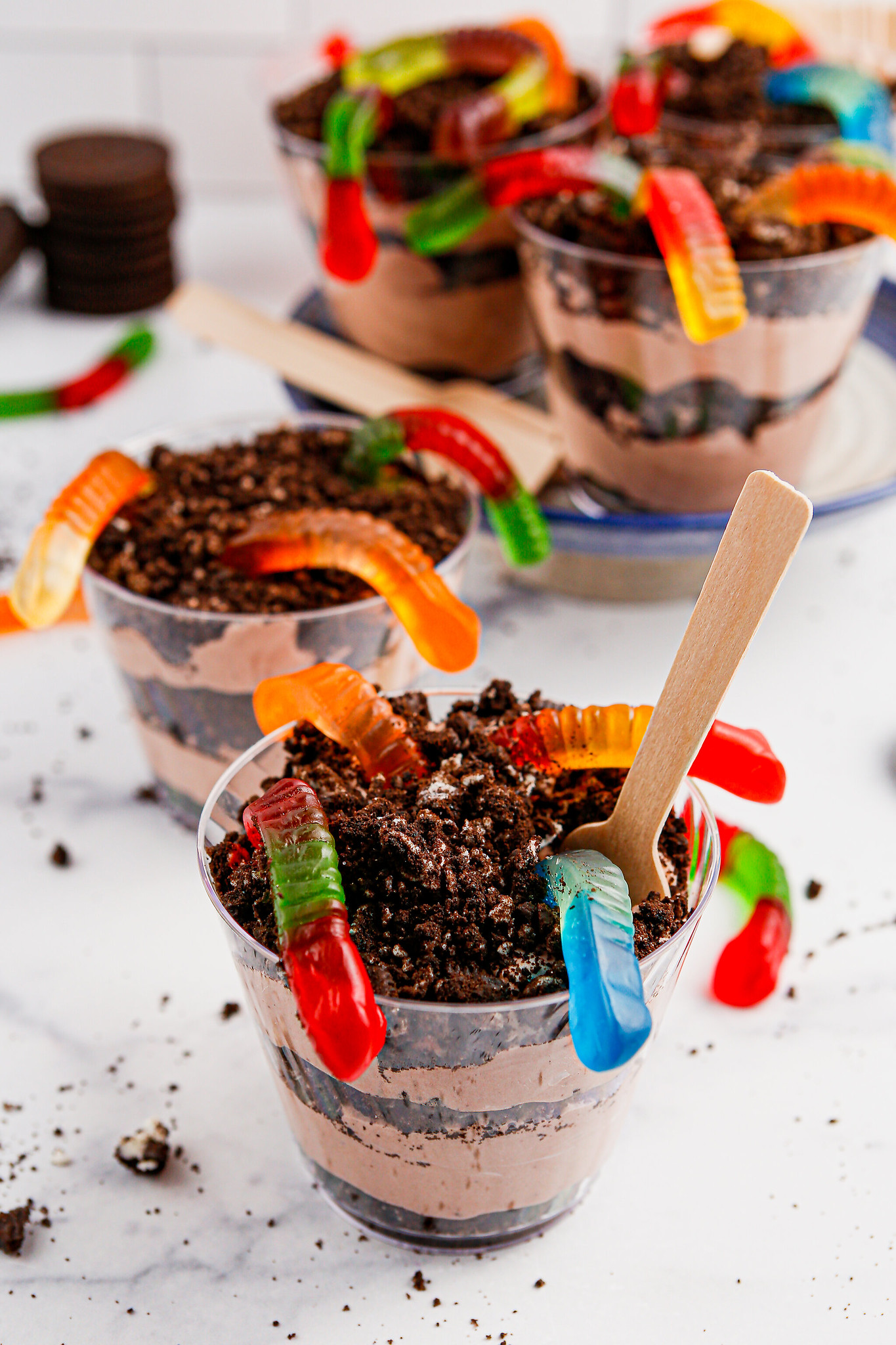 Dirt and Worms Pudding Cups are a fun and delicious treat for kids of all ages! These individual dessert cups are filled with creamy chocolate pudding, crunchy Oreo crumbs, and gummy worms for a playful twist on a classic dessert. Perfect for birthday parties or just a fun snack!