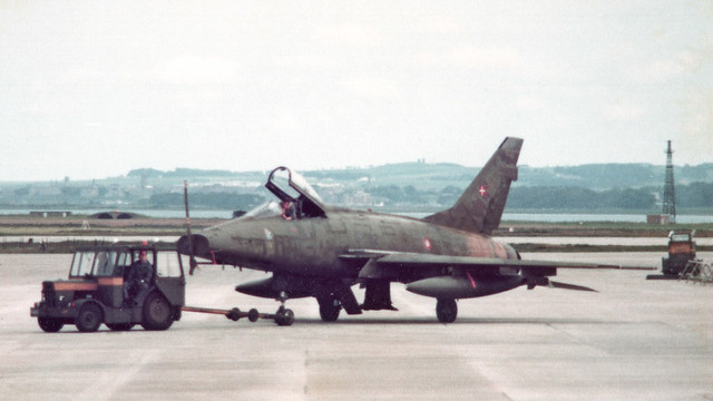 A Danish AF F-100D gets towed at Leuchars. It's a grotty old print, but the jet is G-782 (ex 55-2782). It went on to Turkey, where it survives on the gate at Erhac in its Turkish marks, 7-782.