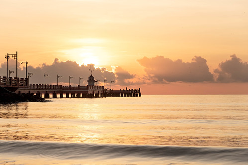 "Here Comes the Sun" by Jeff Stoltzfus, Title and song by The Beatles - 1969
Sunrise over the Saranwithi Pier in Prachuap Bay. sunrise sun
