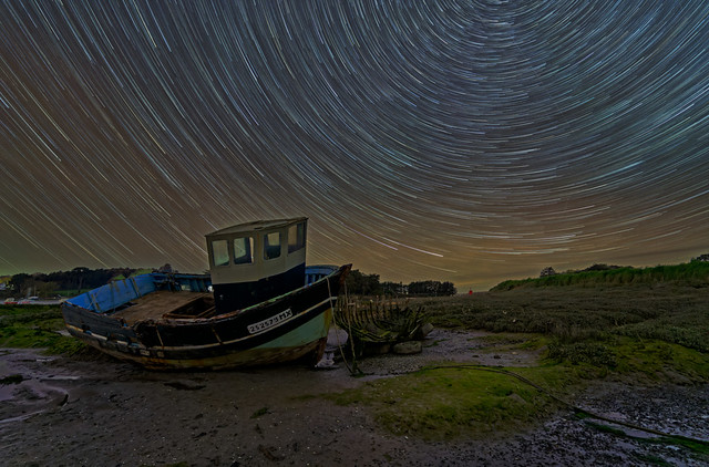 Startrails above a fishing boat at the Toul-an-hery harbour (Plestin-les-grèves)