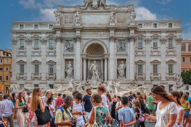 Tourists at the iconic Trevi Fountain
