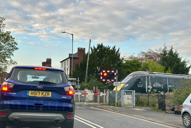 Class 800 passes the level crossing