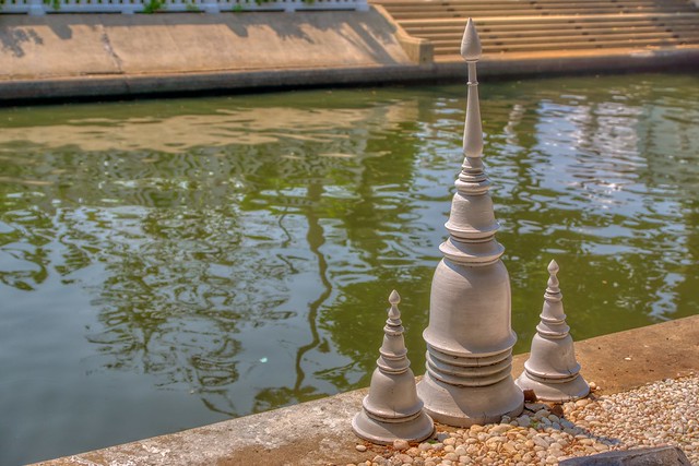 Three mini-stupas by the Khlong (canal) in Bangkok, Thailand