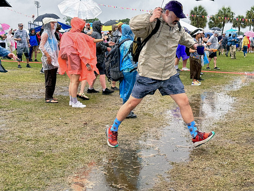 jumping over flood Jazz Fest 4/29/2023 Photo by CharlieSteiner