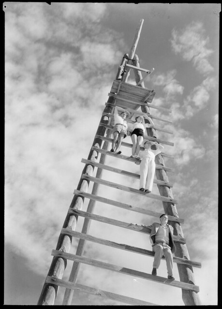 Climbing a tower to look for sharks, Blackhead Beach, Victoria, Australia, 1938