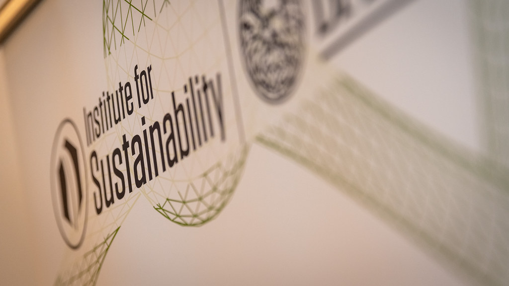 A close-up of the Institute for Sustainability logo on a banner