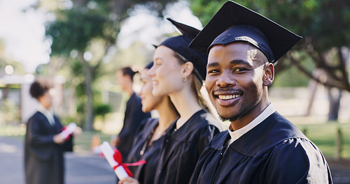 A graduating student smiling while in a line of classmates who are also graduating - Budgeting for Events as a High School Senior