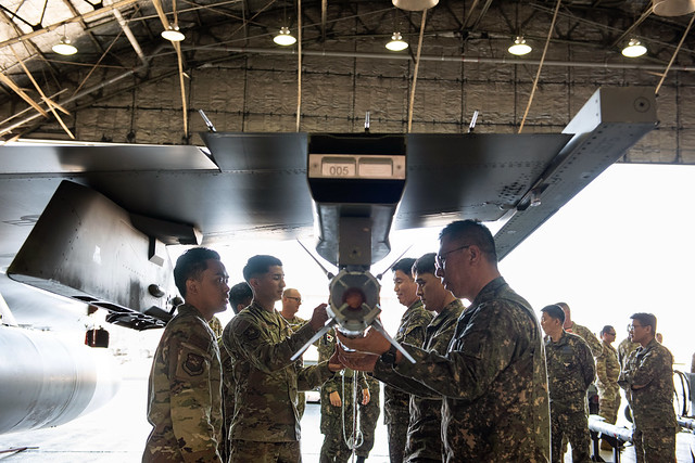 ROK AF senior leaders and USAF personnel take part in an ordinance loading demonstration at Osan Air Base