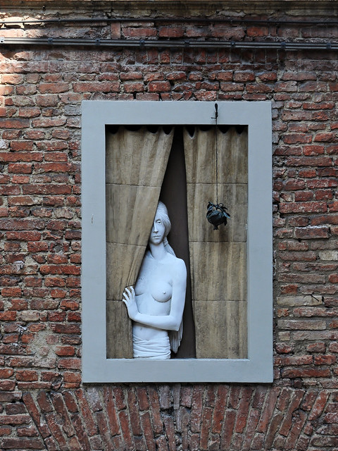 Sculpture of woman at the window