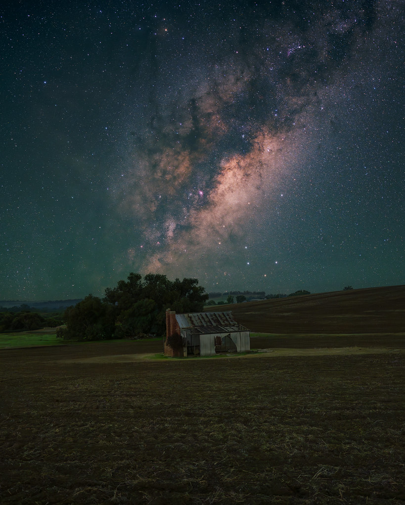 The Milky Way rises over the rolling hills of Marradong country, Western Australia.