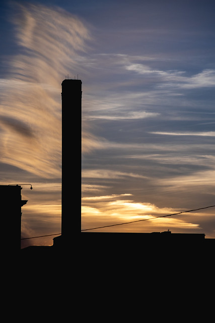 Old Smokestack and Sunset Clouds