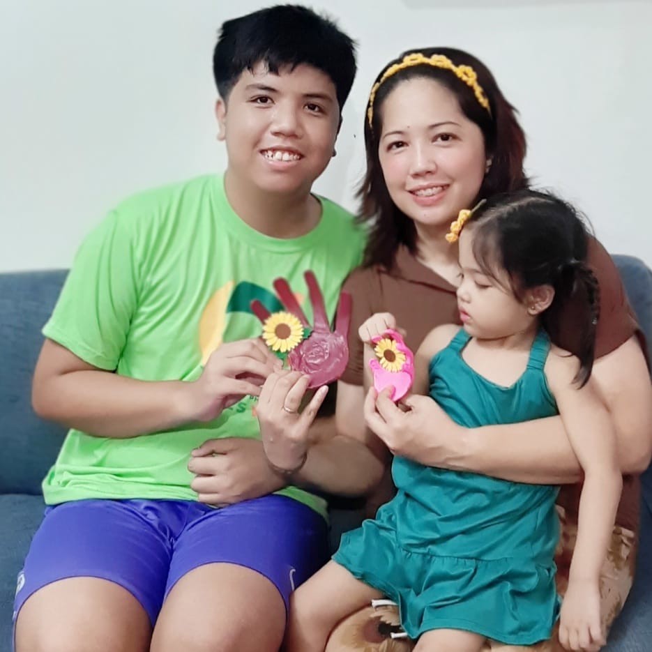 The image shows a mom Genevieve Cruz and her two children Zion who is on a spectrum and Zafina.