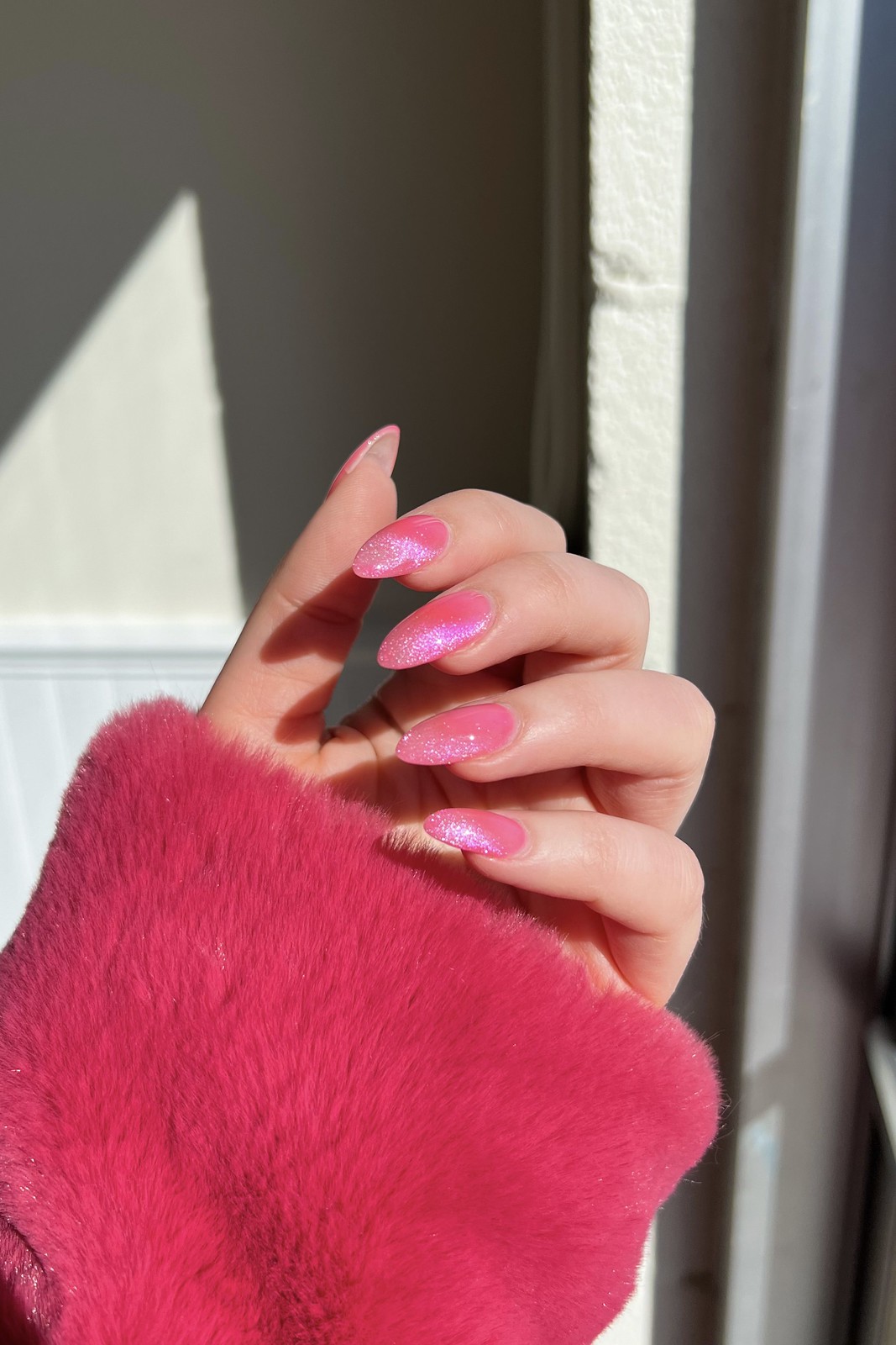 fingernails of a person with Pink Cat Eye Nails for Summer 