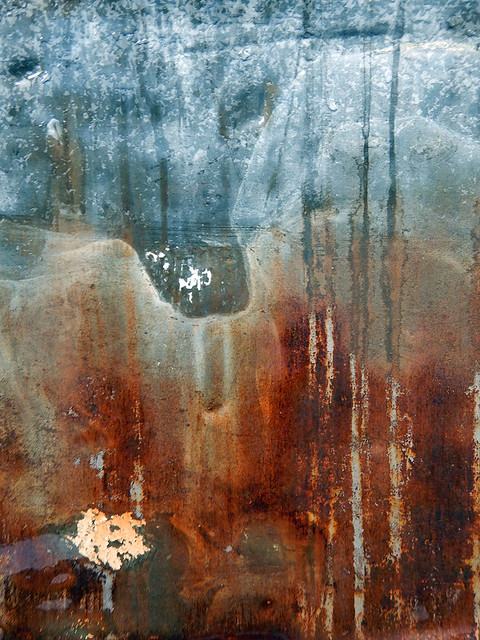 abstract of rusty drips on a metal garage door