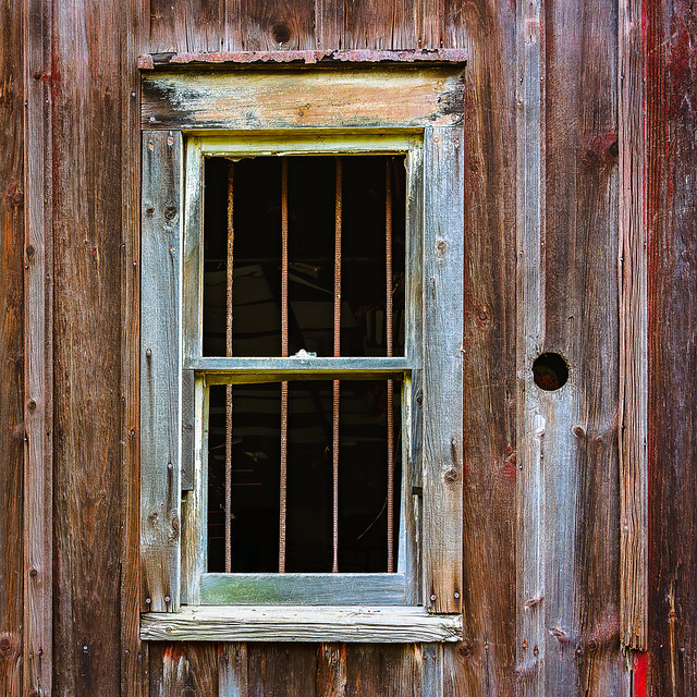 Dark window in an old barn