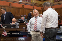House Republican Leader Vincent Candelora talks to state Rep. Greg Howard of Stonington during a session day on May 17, 2023.