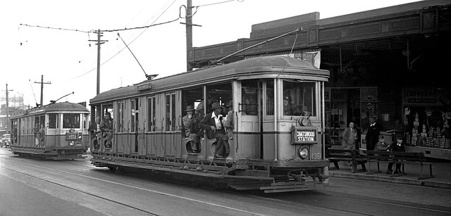 I.D.s 1351 & 002053 thought to be photographed by Leon B. Manny sometime in 1958-00-00 of O class trams 1351 & 818 operating singularly in Blue Street outside North Sydney Railway Station, Sydney, N.S.W., Australia.