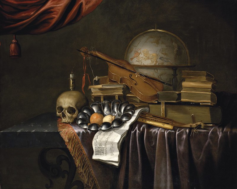 The Monogramist 'JR', Dutch 17th Century - A vanitas with a skull, an orange and a lemon in a pewter bowl, an extinguished candle, books, music, musical instruments and a celestial globe, on partly-draped marble table