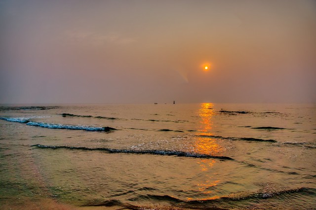 Sunrise over the Gulf of Thailand on the beach in Hua Hin
