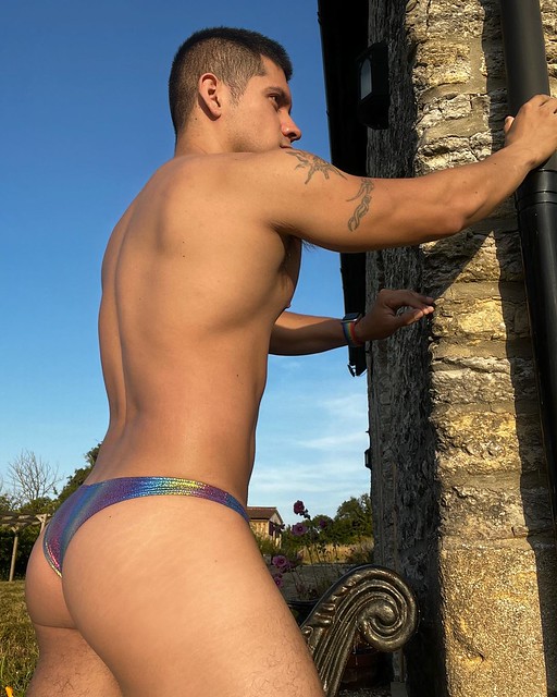 Dante in printed spandex thong swimsuit - rear view