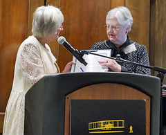 Carol Stevenson receives award from Judi Engle