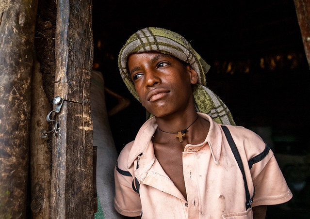 Ethiopian young man looking away, Amhara Region, Lalibela, Ethiopia