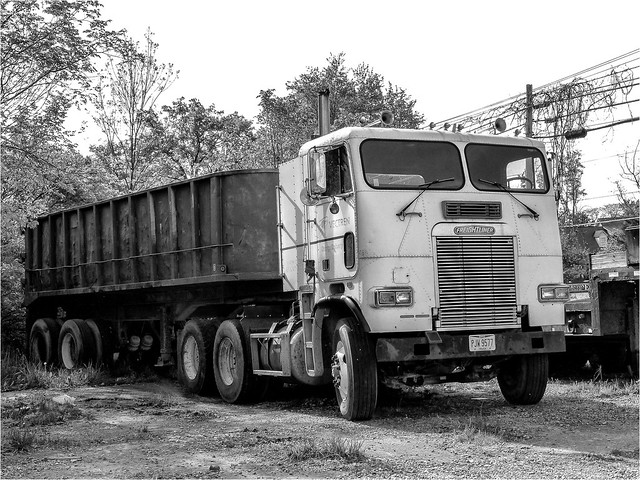 Freightliner COE Semi With A Rusty Old Trailer