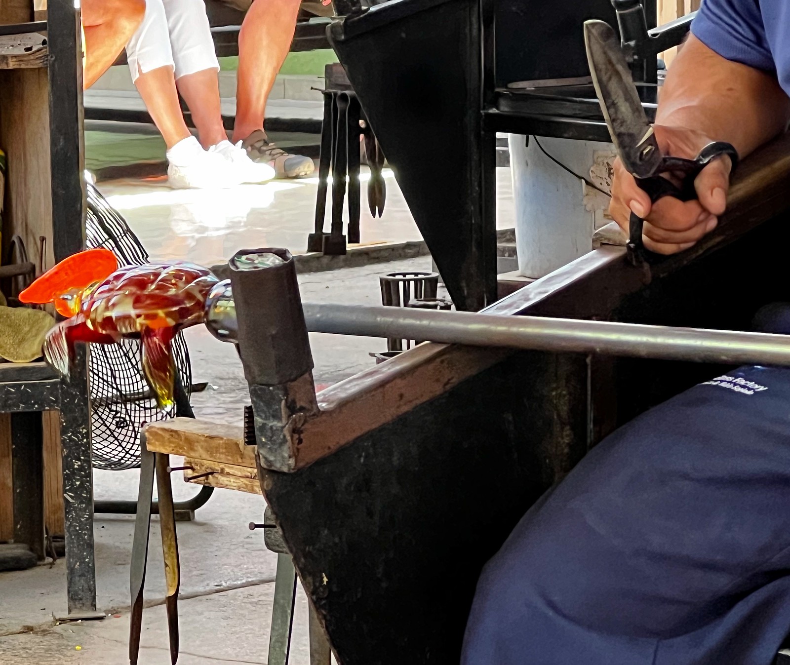 Mexican craftsmen forming molten glass