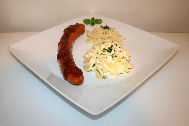 bratwurst with potato salad & cole slaw - Side view / Bratwurst mit Kartoffel- & Krautsalat - Seitenansicht