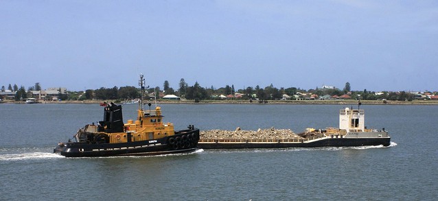 TUG 'KURUTAI' PROPELLING SPOIL BARGE CARRYING MATERIAL FROM HARBOUR DEEPENING PROJECT9th Jan 2012.