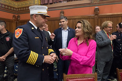 State Rep. Nicole Klarides-Ditria talks with Middletown South Fire District Fire Chief James Trzaski during Connecticut Fire Service Day in the House of Representatives.