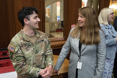 State Rep. Karen Reddington-Hughes talks with U.S. Army Sgt. Matthew Lucibello before the start of session in the House of Representatives.  Sgt. Lucibello was at the Capitol to cover the invocation being delivered by Chaplain, Captain Steven O. Thiel, US Air Force.