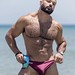 A guy in purple spandex speedo - front view