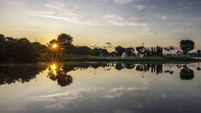Sunstars and Reflections of Orchid Country Club at Sunrise