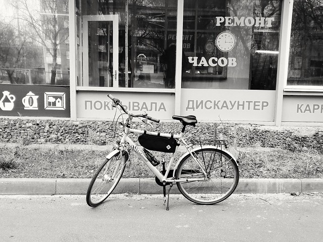 Bicycle parked near the shop