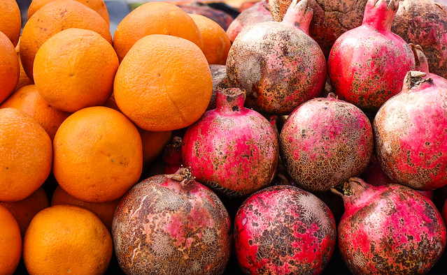Pomegranate and orange fruits at the market