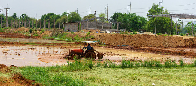 Man on Tractor Creating Paddy Fields - Thailand 28