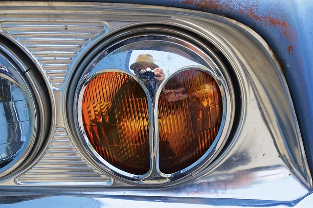 Self-portrait on a Ford Fairlane headlamp